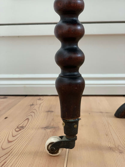 Antique bobbin drop-leaf table with casters