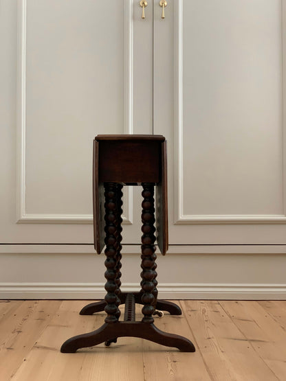 Antique bobbin drop-leaf table with casters