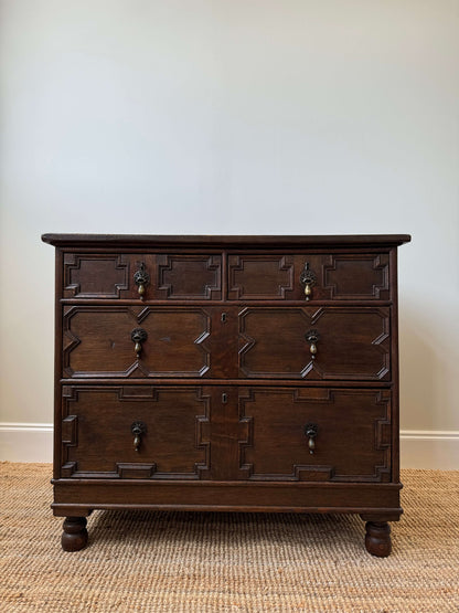 Early Georgian oak chest of drawers on bun feet