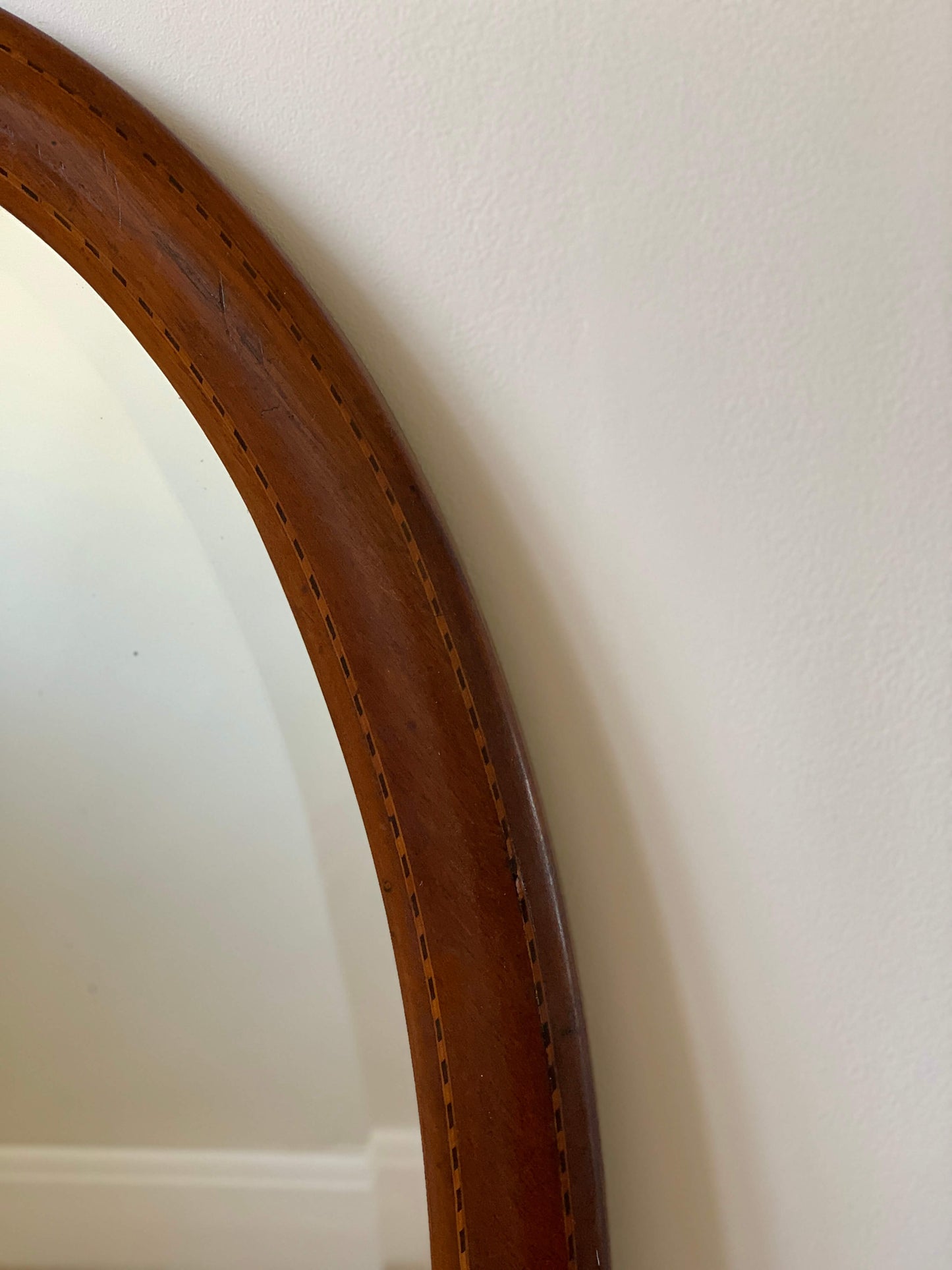 Antique oval mirror with marquetry detail