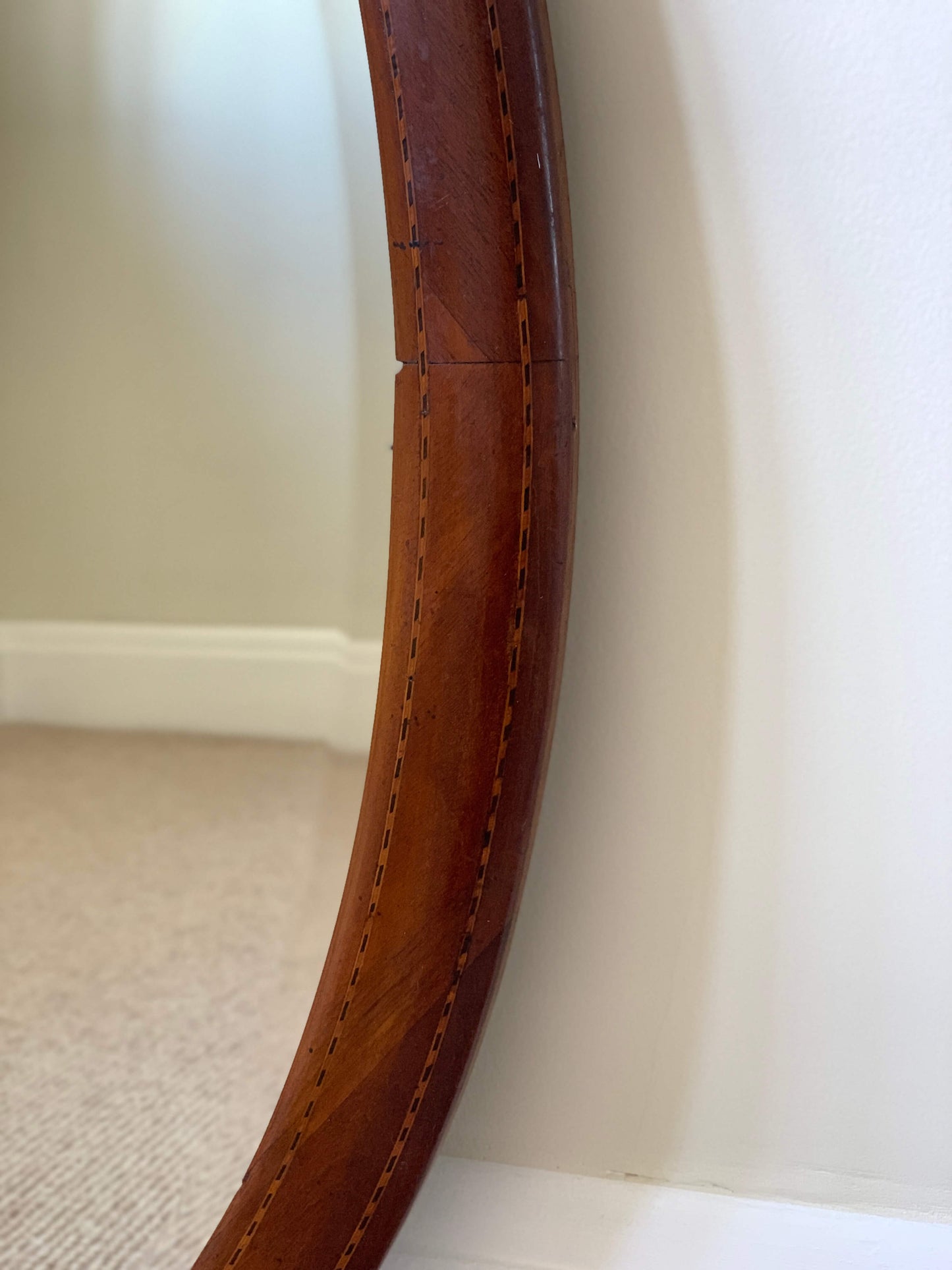 Antique oval mirror with marquetry detail